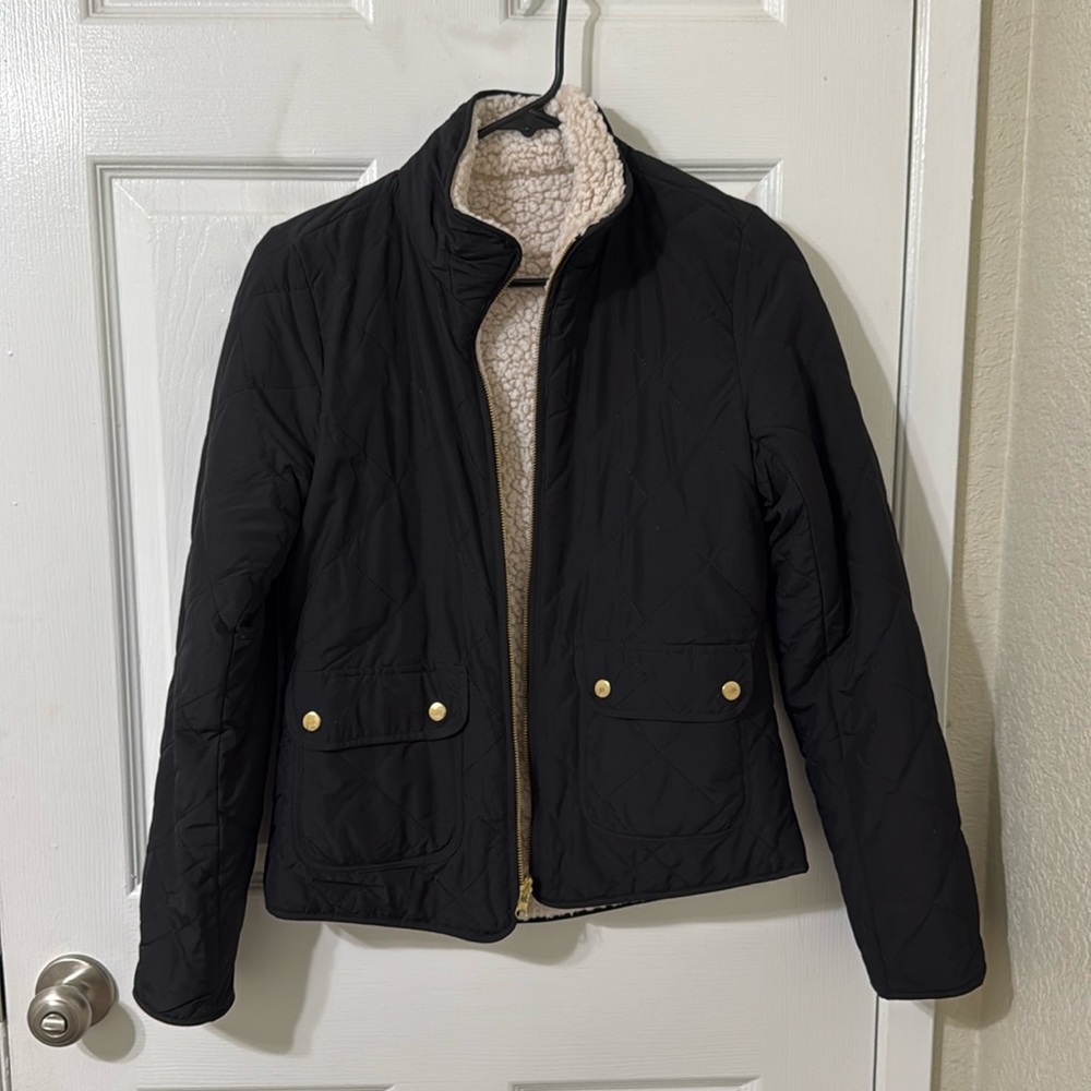 Black puffer jacket with fuzzy inside and gold detailing size small